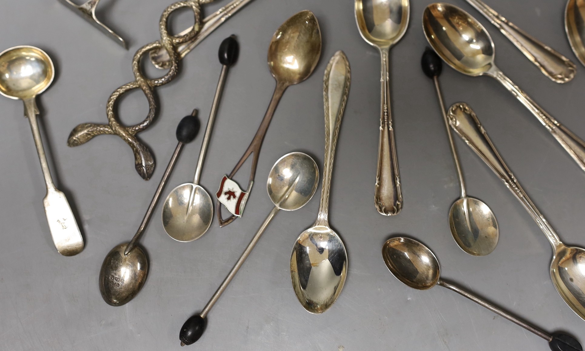 A small group of sundry flatware including a set of six George V silver teaspoons, Sheffield, 1923, a set of six silver bean end coffee spoons etc. and a pair of white metal shell bowl spoons.